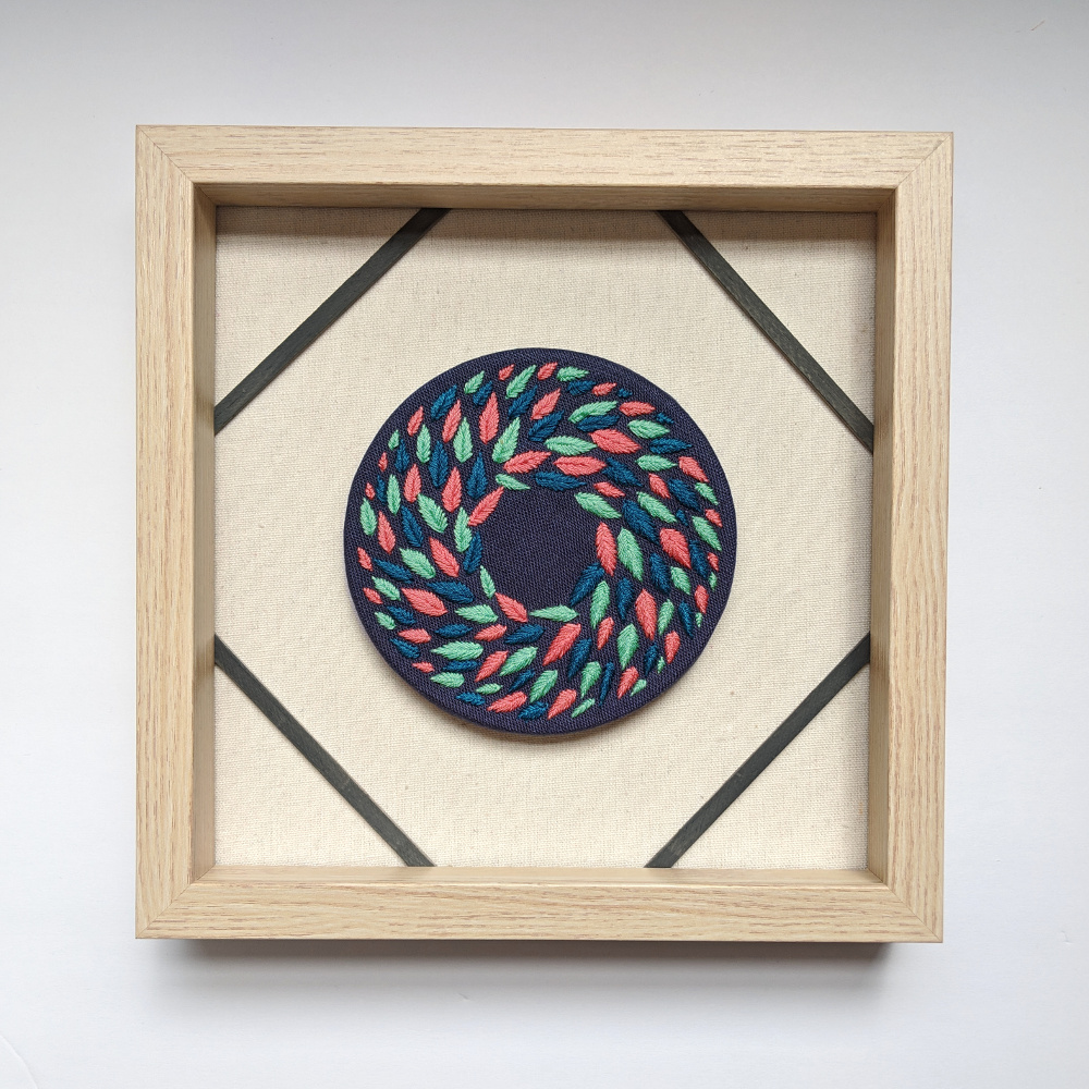 Multi Colored Wreath on Blue Linen